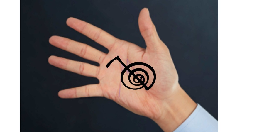 Reiki power symbol in the palm